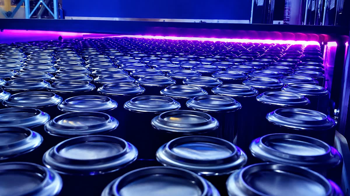 Beverage can bottom rims curing under UV LED on a production line