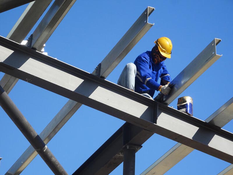 construction worker on a high beam