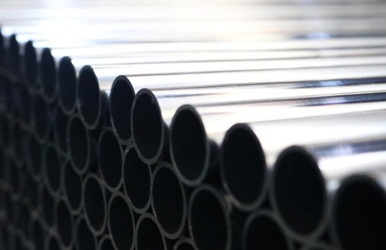 metal tubes stacked on top of one another